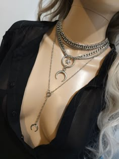 This handmade chunky stainless steel chain layered necklace set is a stunning piece of jewelry that is perfect for those who love bold and edgy accessories. The necklace features two necklaces, one thick chunky cover in an adjustable length, and a 4-strand drop festoon design, adding depth and dimension to the piece with a shiny Fang or cat's claw pendant.  The chunky chain is made of sturdy stainless steel, ensuring its durability and longevity.  This necklace set is an excellent handmade gift for someone special. It is a perfect choice for those who love alternative and goth styles, as well as anyone who wants to make a statement with their jewelry. It runs from 15 to 18 inches in length with a built-in extender. The necklace is waterproof and sweatproof and will never tarnish or fade! 2 Trendy Metal Necklace With Moon Charm, Trendy Metal Jewelry With Moon Charm, Trendy Metal Moon Charm Jewelry, Trendy Silver Moon Jewelry, Trendy Silver Necklace With Moon Charm, Trendy Silver Jewelry With Moon Charm, Chain Layered Necklace, Goth Styles, Chunky Choker