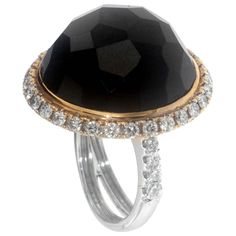 Zorab captures simplicity, elegance, and style with his Multi-Faceted 43.57 Carat Black Spinel dome shaped cocktail ring. The epic bombe center stone's richness is amplified by 1.22 carats of white diamonds circling the rim and extended to each side of the 18 Karat Gold and Palladium. This item has a serial number and bears the stamp of authenticity from Zorab Creation Luxury Cabochon Diamond Ring For Formal Occasions, Luxury Formal Cabochon Diamond Ring, Luxury Domed Cabochon Rings, Formal Domed Gemstone Rings, Luxury Round Cabochon Diamond Ring, Timeless Dome Ring With Gemstone For Formal Occasions, Formal Oval Dome Ring With Center Stone, Luxury Oval Gemstone Dome Ring, Luxury Evening Rings With Round Cut