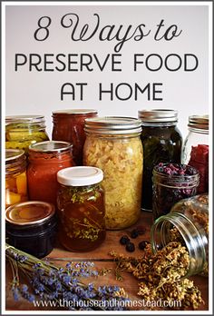 jars filled with food sitting on top of a table next to lavenders and herbs