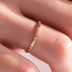 Here's our dainty diamond stacking wedding band for women. This 10K 14K or 18K gold thumb ring has an elegant simple trendy style that pairs well with engagement ring for newlywed women. This thin gold ring can also be a beautiful thumb ring or midi ring for you. This custom and made to order ring would also be great with solitaire and diamond wedding band for your wife, mom or grand mother. This comfort fit band, adorned with simulated diamonds, will be your everyday ring and so special with la Thumb Rings For Women Gold Eternity Bands, Unique Eternity Ring, Dainty Gold Engraved Stackable Rings, Gold Thumb Rings For Women, Simple Gold Rings Everyday, Modern Gold Stackable Engraved Ring, Modern Gold Engraved Stackable Ring, Minimalist Gold Engraved Stackable Ring, Thumb Rings For Women