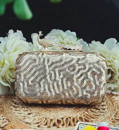 This stunning Party Clutch Bag is embellished with sequin work on a gold silk Base . This Minaudière Clutch is ideal for parties and weddings and any festive occasion. This Handmade Embroidered Embellished Sling Purse can be used with or without the metal sling that is included. Dazzle through the Day or Evening with this beautifully Handcrafted Wedding Bridal Clutch Bag. Perfect for a Bride, Bridal Gift, Bridal Clutch, Wedding Clutch, Mehndi, Nikaah, Shaadi, Sangeet, Indian and Pakistani events Festive Sequined Bags For Reception, Glamorous Embellished Potli Bag For Reception, Hand Embellished Potli Bag For Festival Celebrations, Hand Embellished Potli Bag For Festivals, Gold Bags With Mirror Work For Weddings, Rectangular Gold Embroidered Evening Bag For Receptions, Gold Wedding Bag With Mirror Work, Festive Gold Hand Embellished Bag, Gold Wedding Bags With Mirror Work