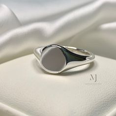 Ring Details - Round Solid Signet Ring  - Ring Front: 10.00mm - Band Width: 3.03mm - Band Thickness: 2.50mm - Gross Weight: 10.00grams - Handmade Ring - Sterling Silver 925  - Hallmarked - Dimensions and Weight Depends on Variations in Sizes. - Available in all Sizes ( Please make sure about your ring sizes) - DM for Customizations NOTE: - Our Products are Made to Order According to Customer's Expectations So It May Take Some Time. Because We Work on Our Products Very Professionally and Passiona Elegant Silver Stainless Steel Signet Ring, Classic Silver Nickel-free Signet Ring, Silver Concave Signet Ring With Polished Finish, Adjustable Nickel-free Signet Ring For Anniversary, Adjustable Sterling Silver Nickel-free Signet Ring, Silver Signet Ring, Ring Sizes, Ring Ring, Hand Engraving