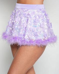 Your wishes are granted with the Genie Dust Floral Sequin Marabou Skirt! Crafted from a stunning purple fabric adorned with shimmering floral sequins and tinsel marabou hem, this magical skirt is your portal to a dreamy fairy tale adventure. 100% Nylon Hand wash cold Thick waistband Fitted Purple Bottoms For Party Season, Glamorous Fitted Purple Bottoms, Purple Sequined Party Skirt, Purple Party Bottoms For Spring, Purple Bottoms For Spring Party, Fitted Purple Sequin Skirt, Summer Party Bottoms With Feather Trim, Purple Lined Party Skirt, Purple Lined Skirt For Party