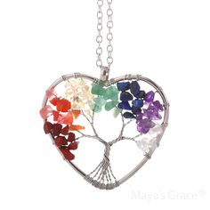 Embrace positive energy with the Maya's Grace Chakra Necklace. This vibrant pendant adds a pop of color to any outfit and features an 18-inch silver cable chain with a 2-inch extension and lobster clasp. Each crystal in the pendant represents a unique quality: Purple: Symbolizes romance and nobility. Tiger's Eye: Enhances inspiration and career success. White: Associated with wisdom and clarity. Pink: Represents love and popularity. Yellow: Symbolizes wealth and good fortune. Tawny: Stands for stability. Green: Represents justice and growth. Jewelry Care: Store in a clean, dry place. Do not wear in water or during sports activities. Clean gently with a soft cloth. About Maya's Grace: At Maya's Grace, a minority-owned brand, our mission is to make beautiful, high-quality jewelry accessible Heart-shaped Natural Stone Crystal Necklace For Healing, Heart-shaped Crystal Necklace With Natural Stones For Healing, Spiritual Heart Beads Pendant Necklace, Spiritual Heart Beads Jewelry For Gifts, Spiritual Healing Crystal Necklace With Heart Pendant, Spiritual Heart Pendant Crystal Necklace For Healing, Multicolor Spiritual Birthstone Jewelry, Spiritual Healing Crystal Heart Necklace, Healing Heart Pendant Jewelry With Natural Stones