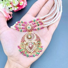 Traditional chandbali design jadau choker make in 22ct hallmarked gold. The necklace weighs 34.04 GMs including 18.54 GMs of hanging and stringing beads. The earrings weigh 11.93 GMs including 2.02 GMs of hanging beads. 22k Gold Jewelry Necklaces, Hanging Beads, 22k Gold Jewelry, Pearl Necklace Set, Choker Necklace Set, Gold Jewelry Necklace, Emerald Necklace, Gold Bangle Bracelet, 22k Gold