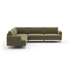 a large sectional couch sitting on top of a white floor next to a wooden leg chair