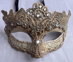 This men's masquerade mask is with lace and jewels on a beige base design. This masquerade mask is ribbon tie concept to create a comfortable fit and great to reuse if needed. Masquerade mask Measurements:  9" inches across 4" inches high This beautiful masquerade mask is great for a birthday party, wedding or Halloween costume party. We do our best to take live, clear and as many pictures as possible to guarantee what you see is what you will receive. Any issues with the purchased product(s) mu Fitted Eye Mask For Carnival Masquerade, Carnival Costume Masks And Prosthetics, Fitted Costume Mask And Prosthetics, Fitted Masquerade Mask For Carnival, Venetian Eye Mask For Costume Masquerade, Venetian Eye Mask For Masquerade Costume, Vintage Halloween Carnival Masks And Prosthetics, Vintage Masquerade Eye Mask For Party, Vintage Masquerade Mask For Mardi Gras Costume Party