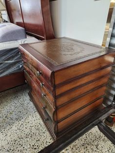 an old wooden chest sitting on top of a floor