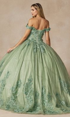 In this glam sage green quinceañera dress, it's easy to feel like a fairytale princess on your 15th birthday. Beautiful 3-D floral appliques on this ball gown quinceañera dress accent the sparkling embroidery that covers the sweetheart bodice, wraps around the dainty off-the-shoulder straps, and trails along the full and fabulous skirt. Glitter fabric gives this embroidered green quince dress a dash of magical shimmer. The lace-up back provides a chic corset design and makes it easy to adjust fo Green Quince Dress, Long Ball Dresses, Green Quinceanera Dresses, Green Ball Gown, Special Ocassion Dresses, Quinceanera Themes Dresses, Off Shoulder Ball Gown, Debutante Ball, Quince Dress