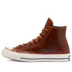 If you're looking for a classic sneaker with a premium twist, look no further than the Converse Chuck 70 High Color Leather 'Clove Brown'. This high-top sneaker features a full-grain leather upper with tonal stitching and waxed laces for a sophisticated look. The debossed All Star patch on the medial ankle adds a touch of retro style, while the glossy off-white rubber midsole provides cushioned comfort. Underfoot, the standard diamond-pattern rubber outsole delivers grippy traction. (SNKR/Unisex) Retro High-top Sneakers With Boost Midsole, Retro High-top Skate Shoes With Boost Midsole, Classic Converse High-top Sneakers For Sports, Brown Retro Custom Sneakers For Streetwear, Classic Converse High-top Sneakers, Classic High-top Lace-up Sneakers For Streetwear, Vintage Lace-up Sneakers With Rubber Toe Cap, Classic Lace-up High-top Sneakers For Streetwear, Brown High-top Sneakers With Speckled Midsole For Streetwear