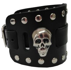 This is a handmade genuine leather watchband with Skull Head Conchos it is a classic style watchband. the cuff has a border of rivets. The has a sturdy buckle for fastening and adjusting the size. Punk Leather Wristband For Festivals, Punk Style Leather Wristband For Festivals, Gothic Leather Bracelet With Rivets, Punk Style Silver Leather Wristband, Punk Leather Strap Bracelets, Adjustable Leather Punk Wristband, Edgy Leather Bracelet For Concerts, Adjustable Leather Rock Style Bracelet, Adjustable Rock Style Leather Bracelet