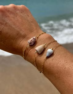 ✨Mexico X Kauai" Collection ✨ * This listing is for one 14k gold filled Kauai cone shell charm bracelet  * Tiny Keshi pearl at clasp * Genuine & rarer hand picked Kauai cone shells * Effortless style for everyday wear * 14k gold fill bambo, fancy chain and link or dainty paper clip chain of your choice * New style only found here  * Hand picked & crafted in Kauai, Hawaii * Bracelet length approx. 6.25"-8" total with extender chain If you would like additional length or if you are unsure of your bracelet size, you are able purchase the chain extender listing below to add extra inches to your piece. This is a thick 14k gold fill oval hooped chain which allows you to clasp anywhere along the chain for your desired length. This also gives you the option to wear your bracelet at different lengt