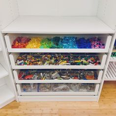 the shelves are filled with legos and other toys