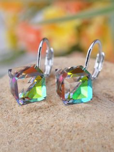 Brighten up your outfit with these Geometric Rhinestone Earrings! Made with silver and iridescent cubes, these earrings are a fun and stylish addition to any look. Shine on (literally) with these unique and modern earrings. Earrings Artificial, Cube Earrings, Magic Crystal, Mother Daughter Jewelry, 90s Home, Cube Shape, Daughter Jewelry, Magic Cube, Crystal Fashion