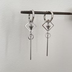 Introducing our effortlessly chic geometric dangling earrings in stainless steel - a must-have addition to your jewelry collection! These trendy unisex earrings are perfect for both men and women, adding a modern touch to any outfit. The sleek, minimalist design makes them versatile for any occasion, whether you're dressing up for a night out or adding a subtle statement to your everyday look. Elevate your style with these geometric earrings that are sure to turn heads and make you stand out fro Casual Stainless Steel Dangle Hoop Earrings, Everyday Stainless Steel Dangle Hoop Earrings, Everyday Dangle Earrings In Stainless Steel, Trendy Stainless Steel Dangle Earrings, Minimalist Stainless Steel Dangle Hoop Earrings, Minimalist Stainless Steel Hoop Earrings, Modern Stainless Steel Hoop Earrings For Pierced Ears, Trendy Stainless Steel Drop Earrings, Modern Hypoallergenic Dangle Cartilage Earrings