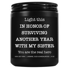 a jar of black candle with the words, light this in honor of surviving another year with my sister you are the real hero