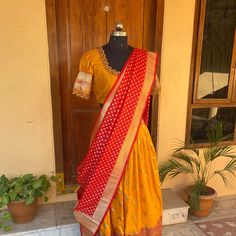 Wedding lehenga choli/ lehenga set with dupatta / teens lehenga/ bridal lehenga/ kids lehenga Indian banarasi half saree / crop top lehenga/ lehenga USA / Langa voni / voggish / yellow red lehenga / pattu pavadai Here is a beautiful and traditional Indian banarasi katan silk lehenga in mustard yellow color with red color border combination is a stunning piece for your upcoming parties!! It's a 3 piece set that includes skirt , hand embroidered blouse and red banarasi dupatta, please find the det Traditional Drape Gown With Unstitched Blouse For Navratri, Yellow Lehenga With Unstitched Blouse For Puja, Festive Lehenga With Zari Work In Traditional Drape, Yellow Chanderi Lehenga With Unstitched Blouse, Bollywood Choli With Zari Weaving For Navratri, Dola Silk Lehenga For Puja, Yellow Lehenga With Zari Work For Puja, Designer Lehenga For Diwali In Traditional Drape, Designer Yellow Lehenga With Self Design