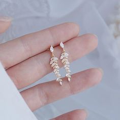 Material: 14k real gold/925 silver plated and Zirconia Small Earrings size: Length 3.1cm, width 0.8cm Medium Earrings size: Length 3.5m, width and 0.9cm *CLIP ON GOLD/SILVER EARRINGS EARRINGS AVAILABLE. MESSAGE US. https://www.etsy.com/listing/1173319723/clip-on-real-gold-plated-14k Care Instruction: Avoid Heat & Chemicals Like perfume, Alcohol, etc and Clean with Dry cotton. H O W ∙ T O ∙ O R D E R * Select your Style in the drop down menu. * Choose the style. * Choose color O T H E R ∙ I N F O R M A T I O N * All items are nicely packaged ready to gift in elegant jewelry boxes. * If you can't find the information you need or need some advice for your design? Feel free to contact us. We are fast to reply :) T U R N ∙ A R O U N D ∙ T I M E * This design is ready to ship Next  business days Silver Payal, Earring Bridal, Bridal Earring, Leaf Earring, Wedding Earring, Botanical Earrings, Jewelry Delicate, Earring Wedding, Gold Leaf Earrings