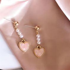 Description:Chic Pearl Heart EarringsSpecifications:Material: Eco-plated Copper, Pearl, 24k GoldSize: 3.3 cm * 1.8 cmWeight: 5 g/pair "Add a touch of elegance and love to your outfit with these Chic Pearl Heart Earrings. Perfect for any occasion, these earrings will make you stand out with their unique design. Embrace your playful side with these trendy earrings!" Heart Dangle Earrings, Trendy Earrings, Heart Earrings, Heart Design, Gifts For Women, Copper, Unique Designs, Dangle Earrings, Great Gifts