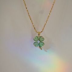 Introducing our Lucky Necklace, a symbol of luck and elegance. This necklace features a charming four-leaf clover pendant crafted from exquisite jade, with a sparkling crystal at its center. Measuring 18 inches in length, it's adorned with opulent 24kt gold plating that retains its pristine shine, even after years of wear. Many of our valued customers have cherished their pieces for up to 2 years, a testament to its enduring quality. The Jade Four Leaf Clover Charm Necklace isn't just an accesso Cute Acssesories, Luck Necklace, Cute Pendant Necklace Charms, Tiffany Clover Necklace, Four Clover Leaf, Lucky Necklace, Gold Pendants, Crystals Necklace, Cute Accessories Aesthetic