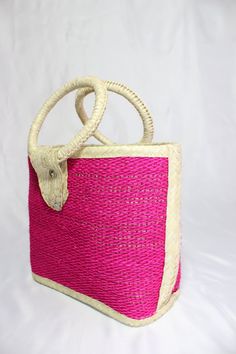 Straw purses are handcrafted by indigenous women from Mexico. They are very strong and resistant and come in different colors like pink, or multicolored. There are three different sizes which are a small, medium and large. The large measures 13½ inches wide, 5 ½ inches long and 19 inches tall include the handle. The medium is 11½ inches wide, 4 ¼ inches long and 16 inches tall including the handle. Handmade Pink Straw Bag For Travel, Pink Handheld Straw Bag For Everyday Use, Traditional Pink Woven Bag, Handmade Pink Straw Bag For Everyday Use, Pink Handmade Straw Bag For Everyday Use, Rectangular Pink Straw Bag For Daily Use, Pink Rectangular Straw Bag For Daily Use, Pink Square Straw Bag For Everyday Use, Pink Square Straw Bag For Daily Use