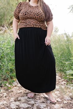 Effortlessly elegant and versatile, the Jocelyn Maxi Skirt is a must-have for any wardrobe. Crafted from a lightweight fabric, its maxi length and split sides provide a flowy and flattering fit. The elastic waist ensures comfort all day long. Embrace your inner goddess with this stunning skirt! The split sides measure 19"-20" from the top of the waistband. Fits true to size. Model is wearing a 1X and is 5'7". Size Chart Length Waist 1x 40" 38" 2x 40" 40" 3x 40" 44" *Measurements are approximate Versatile Flowy Lined Maxi Skirt, Versatile Solid Color Maxi Skirt With Elastic Waistband, Solid Rayon Maxi Skirt With Lining, Solid Rayon Lined Maxi Skirt, Solid Color Rayon Maxi Skirt With Lining, Flowy Solid Color Maxi Skirt For Day Out, Solid Color Rayon Lined Maxi Skirt, Rayon Gathered Maxi Skirt, Rayon Maxi Skirt With Gathered Detail