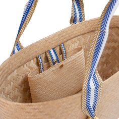 This oversize bamboo tote bag effortlessly combines practicality and style. It's the perfect beach bag, and is skilfully handcrafted from bamboo using a double-layer, Lombokian weaving technique to a robust yet lightweight finish. It features blue stripe jacquard handles and a popper stud closure. The roomy interior is designed to take your daily essentials, and much more, and includes an internal bamboo pocket with stud closure for your valuables and a jacquard lanyard to secure additional belo Woven Beach Bags, Perfect Beach Bag, Large Beach Bags, Woven Bags, Bamboo Crafts, Bamboo Bag, Bamboo Weaving, Bag Details, Large Pouch