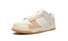 The Nike Dunk Low “If Lost Return To” is a colorway of the retro basketball shoe with a patchwork-like arrangement of textile overlays.  A versatile colorway with neutral tones, the “If Lost Return To” Dunk Low features a white textile base with a beige leather toe cap, tan leather on the forefoot and eyelets, and beige leather on the heel overlay.  A Sail leather Swoosh logo appears on both sides of the shoe.  On the back, an orange “Nike” logo matches the stitching found on the heel.  An “If L White Textile, Dunk Low Nike, Retro Basketball Shoes, Retro Basketball, Sb Dunk Low, Stadium Goods, Sb Dunk, Swoosh Logo, Nike Dunk Low