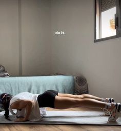 a woman laying on top of a yoga mat