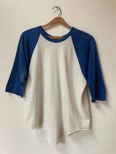 True vintage 1970's baseball Tee. A real classic beauty. Some possible bleaching of the sleeves as per pictures. PTP 20 1/2" Length: 27" (longest) 23" (shortest), Sleeve: 20" Tag: faded Fabric: 100% cotton No refunds, returns or exchanges. You have options in shipping. We will only ship outside of North America with tracking. Faded Fabric, Baseball Vintage, Baseball Shirt, Vintage Baseball, Baseball Shirts, Classic Beauty, Baseball T Shirts, Vintage 1970s, True Vintage