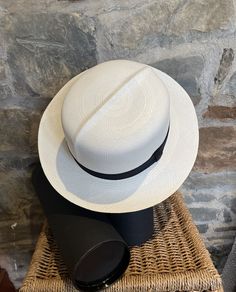 A Genuine Handmade Folder Panama Hat with Travel Tube from Cuenca in Ecuador An Elegant alternative to the traditional Fedora Style Panama Hat Can be folded along the crease or rolled Available in sizes from 54cms - 60cms Brisa Weave - Rollable White with Black Band Panama Hat production is a traditional cottage industry in Ecuador providing employment for many families. We pride our service on hat size being right first time in over 85% of our transactions. However if a hat doesn't quite fit co Elegant White Fedora With Flat Bill, White Handwoven Straw Hat With Short Brim, Classic Handwoven Panama Hat With Short Brim, Traditional White Wide Brim Hat, Traditional Toquilla Straw Panama Hat With Flat Brim, Traditional Panama Hat With Short Brim, Traditional White Panama Hat With Wide Brim, Handwoven White Brimmed Hat, White Handwoven Brimmed Hat