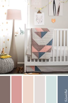 a baby's room with pink, blue and grey colors