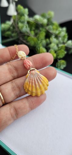 Sunrise Seashell with Pikake Flower Gold Necklace Materials: -Bright orange and pink Actual Shell shown -Pikake Flower -Cable Chain 14K Gold Filled -14K gold filled Lobster Claw Closure  Sunrise Seashell Hawaii Gift Seashell from Hawaii All Sales are Final  --- Packed ready for gift giving Orange Flower Jewelry For Beach, Orange Flower-shaped Jewelry For Beach, Orange Flower-shaped Beach Jewelry, Pink Shell Necklace Gift, Handmade Pink Shell Necklace, Handmade Pink Shell As A Gift, Handmade Pink Shell As Gift, Handmade Pink Shell, Pink Shell Necklace Perfect For Gifts