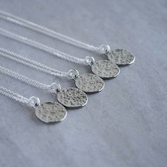 This all sterling silver necklace features a full moon with a textured, cratered surface. The face of the pendant measures approximately 0.65 x 0.53 inches and the back is stamped with my maker's mark and sterling silver quality stamp (925). The chain is a beveled cable chain and is shown at 18 inches long on the mannequin. Choose your chain length from the drop down menu. ★ All orders come wrapped in a gift box, ready for gifting ★ Moon Shaped Sterling Silver Necklace With Coin Pendant, Sterling Silver Moon Necklace With Coin Pendant, Silver Moon-shaped Jewelry With Coin Pendant, Hammered Sterling Silver Round Charm Necklace, Silver Moon Necklace With Coin Pendant, Silver Hammered Round Pendant Necklace, Hammered Silver Coin Necklace In Sterling Silver, Silver Charm Necklace With Moon Phase Round Pendant, Silver Medallion Coin Necklace With Moon Charm