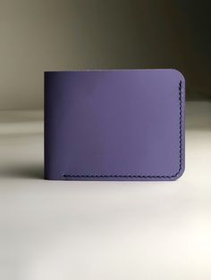 It is small blue wallet with 100% leather to serve you for a long time. It is small, lightweight, fits in your pocket. This is a wonderful personalized gift for your loved one. minimalist wallet women that combines elegance, classic and casual style. The custom wallet is made of genuine blue leather the wallet is stitched with red thread and made by hand with French stitching. The small personalized wallet make a beautiful gift for mother birthday gift, wife birthday gift, sister birthday gift. Wallet description: - Genuine leather - color blue-lavender - 4 card slots - 1 pockets for money - skin stretches to fit your lifestyle - painted and polished edges. - lavender thread, waxed - 100% handmade - Dimensions: Overall size: width 4.33 "- 11 cm height 3.5" - 9 cm Please note that due to th Blue Rectangular Wallet Perfect For Gift, Blue Rectangular Wallet For Gift, Rectangular Blue Wallet Perfect For Gifts, Rectangular Blue Wallets For Gifts, Foldable Bifold Wallets For Daily Use, Foldable Bifold Wallet For Daily Use, Rectangular Smooth Grain Wallet As Gift, Rectangular Wallets With Interior Card Slots As Gift, Blue Bifold Coin Purse For Gift