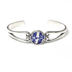 "9th Anniversary Gift for Wife, Blue Willow Love Birds Broken China Jewelry,Dainty Sterling Silver Cuff Bracelet Repurposed blue willow ware china plate. Lovebirds! Artfully repurposed from a vintage china plate. This cuff bracelet is delicate yet strong, easy to slip on and a very comfortable fit. Sterling silver cuff bracelet is shiny silver with lightly antiqued details. Circle setting measures .5\" wide. One size fits most, from teenage to adult. Set in sterling silver for a beautiful, timel Classic Adjustable Cuff Bracelet For Wedding, White Gold Cuff Jewelry For Anniversary, Gift White Gold Cuff Bracelet, White Gold Cuff Bracelet Gift, Blue Round Cuff Bracelet For Formal Occasions, Blue Sterling Silver Cuff Bracelet For Anniversary, Elegant Blue Cuff Bracelet For Gift, Classic White Cuff Bracelet For Wedding, White Gold Cuff Bracelet For Gift