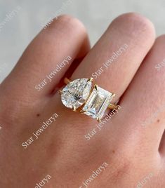 a woman's hand with an engagement ring on top of her finger, and the diamond