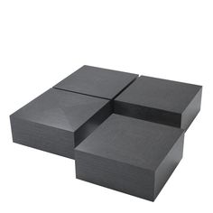 three square black boxes sitting on top of each other