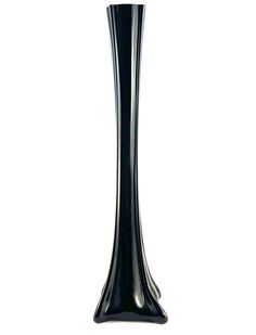 a tall black vase sitting on top of a table