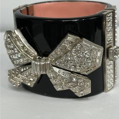 Chanel Bracelet 100% Authentic Never Worn Black With Crystal Bow Absolutely Beautiful! Unfortunately I Don’t Have A Box It Is A Perfect Condition Bracelet Chanel Cuff Bracelet, Chanel Cuff, Chanel Bracelet, Jewelry Chanel, New Bracelet, Chanel Jewelry, Wearing Black, Womens Jewelry Bracelets, A Box