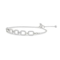 The bracelet is made up of 5 pave diamond links united by gold connectors. With a timeless design and adjustable slider clasp, this bracelet is imbued with style and comfort. Adjustable Pave Diamond Bracelet, Adjustable Pave Setting Bracelets For Anniversary, Adjustable Pave Setting Bracelet For Anniversary, Classic Diamond Bracelet With Adjustable Chain For Formal Occasions, Classic White Gold Tennis Bracelet With Adjustable Chain, Classic Formal Diamond Bracelet With Adjustable Chain, Luxury Diamond Tennis Bracelet With Adjustable Chain, Luxury Adjustable Diamond Bracelet For Anniversary, Diamond Bracelet With Adjustable Chain