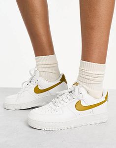 Nike Air Force 1 '07 Next sneakers in white and bronze | ASOS Gold Sneakers With Contrast Sole For Streetwear, Gold Low-top Sneakers With Contrast Sole, Nike Gold Sneakers For Streetwear, Gold High-top Sneakers With Gum Sole, Gold High-top Sneakers With Contrast Sole, Nike Gold High-top Sneakers, Sporty Gold Sneakers For Streetwear, Nike Gold Sporty Sneakers, Gold High-top Sporty Sneakers