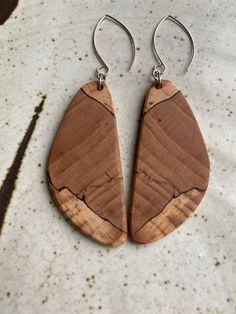 Earrings by juried Kentucky Crafted artist Wesley Page.  Wesley carefully selects each piece of wood for character and color.  All earrings are expertly and artistically matched by grain pattern, which is a fine, skilled art.   All earrings are: * Made with Kentucky hardwoods * Lightweight and of high quality * Set in Argentium silver * Finished with our natural recipe using local beeswax Artisan Wood Handmade Earrings, Handmade Artisan Wood Earrings, Handmade Wood Drop Earrings, Handmade Wooden Drop Earrings, Artisan Brown Wooden Earrings, Artisan Brown Wood Earrings, Unique Natural Wood Jewelry, Unique Brown Wooden Earrings, Unique Natural Wood Earrings