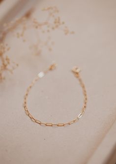 A delicate link chain that catches the light perfectly. Bracelet is adjustable from 6.5 - 7". Available in 14kt Gold Fill + Sterling Silver. Claire stacks it with our Pearl Bracelet. Cat pairs it with our Wander Cuff. Handmade in Eau Claire, WI. Our jewelry is handmade so each piece will be unique and may vary slightly from what is pictured. Copper Uses, Everyday Wear Jewelry, Adornment Jewelry, Jewelry Cleaner, Jewelry Making Tutorials, Jewelry Case, 14kt Gold, Bracelet Stack, Pearl Bracelet