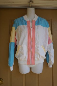 Vintage 90s windbreaker jacket marked size 10. Light weight and great for jogging. In good vintage condition. Measurements taken across front lying flat23" armpit to armpit15" across waist22" length 80s Windbreaker Outfit, Windbreaker Outfit, 80s Windbreaker, 90s Windbreaker, Studded Leather Jacket, Studded Jacket, Lace Layers, Birthday Suit, Womens Jackets