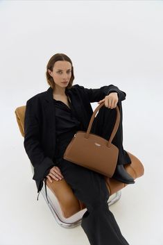 The Tan Leather Shoulder Bag Margot is a must-have for anyone with style. With its spacious, structured design, it offers functionality and elegance. Handcrafted with attention to detail, it complements any outfit, in an enduring piece. Timeless Formal Shoulder Bag With Double Handle, Timeless Structured Everyday Bag, Elegant Structured Shoulder Bag, Timeless Leather Baguette Bag For Business, Timeless Structured Bags, Timeless Office Shoulder Bag With Removable Pouch, Timeless Business Shoulder Bag With Detachable Handle, Timeless Top Handle Baguette Bag For Business, Timeless Shoulder Bag With Removable Pouch For Office