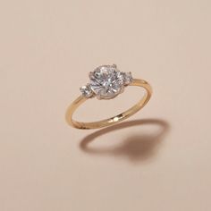 an engagement ring with three diamonds on it