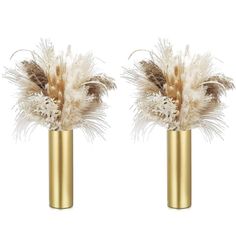 two gold vases with feathers in them