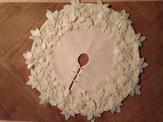 a cake decorated with white flowers and a wooden spoon