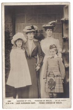 an old black and white photo of three people